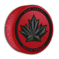 Hockey Canada IIHF Inglasco 2026 Winter Olympics Red Souvenir Hockey Puck product image 1, provided for visual reference and
