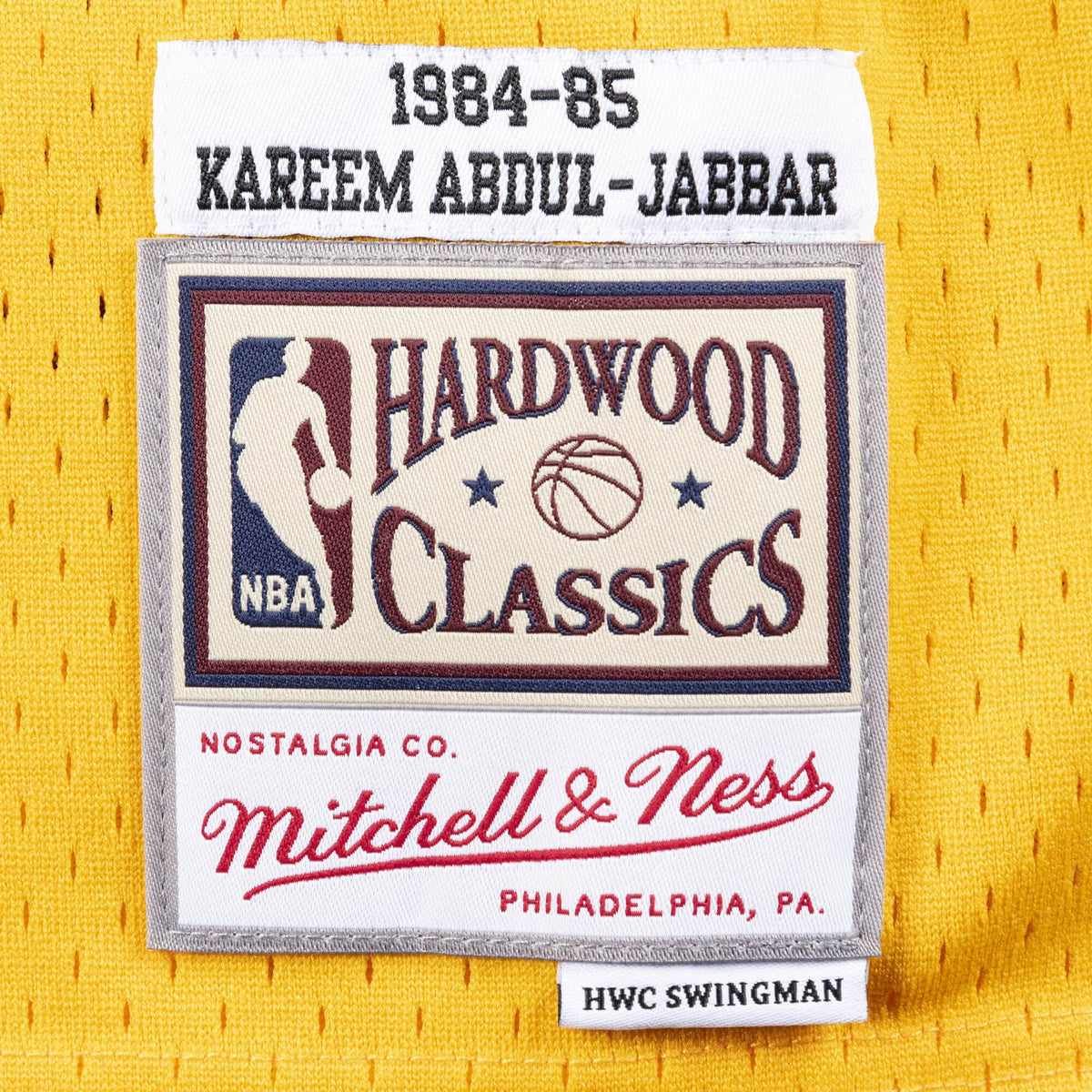 Kareem Abdul-Jabbar Los Angeles Lakers NBA Mitchell & Ness Men Gold 1984-85 Hardwood Classics Swingman Jersey product image